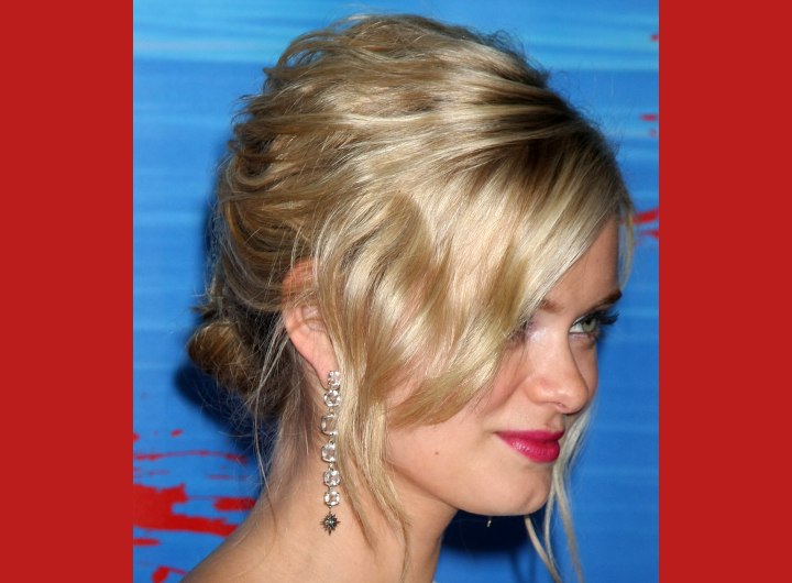 Sara Paxton wearing her hair up in a bun