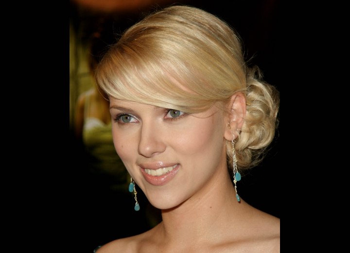Scarlett Johansson wearing her hair in a combination of straight and curly