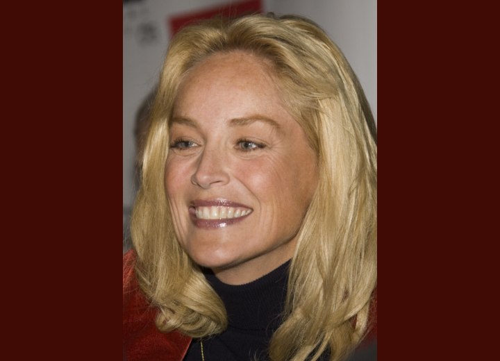 Sharon Stone wearing a turtleneck and long hair