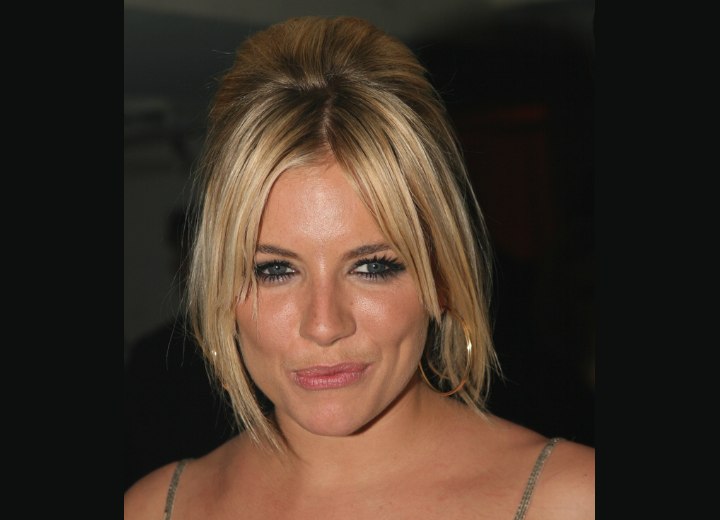 Sienna Miller wearing her hair in an updo