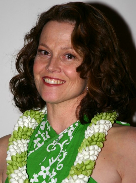 Sigourney Weaver with her hair in waves and curls