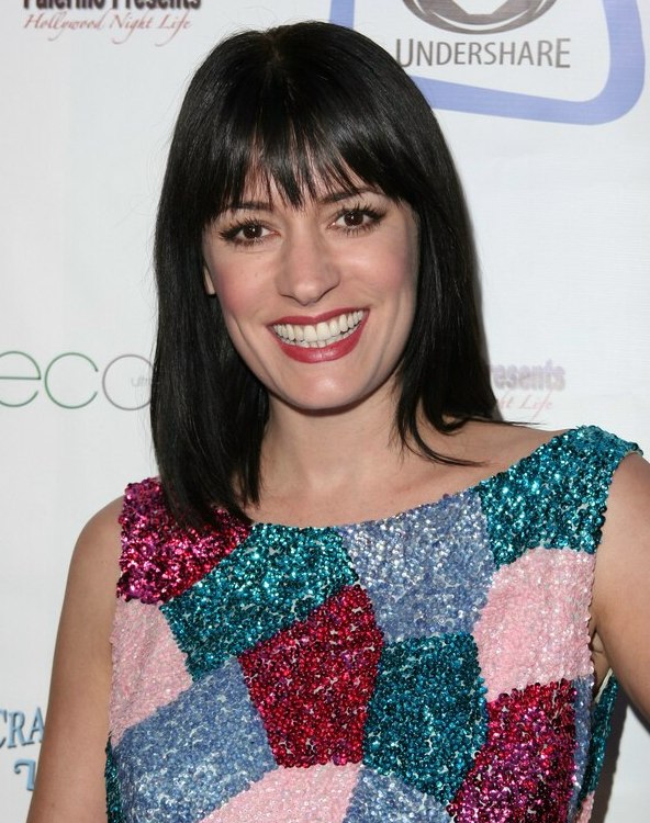 Paget Brewster wearing her hair in a clean straight bob that rests upon