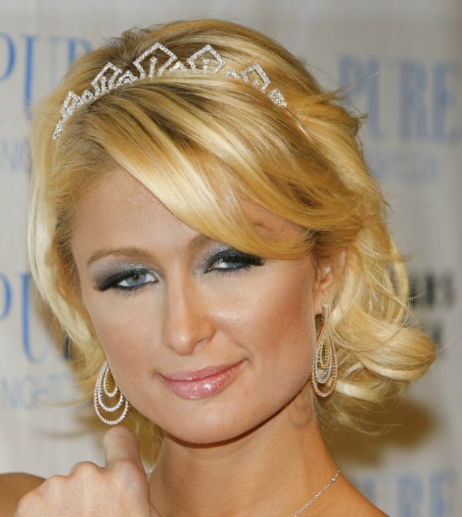 Paris Hilton with wispy medium long hair and a tiara