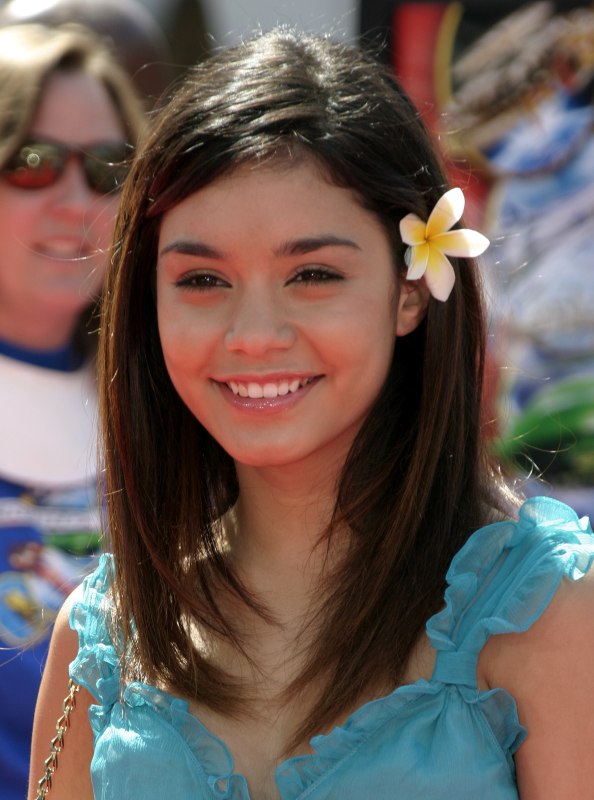 Vanessa Hudgens wearing a flower in her straight hair and 