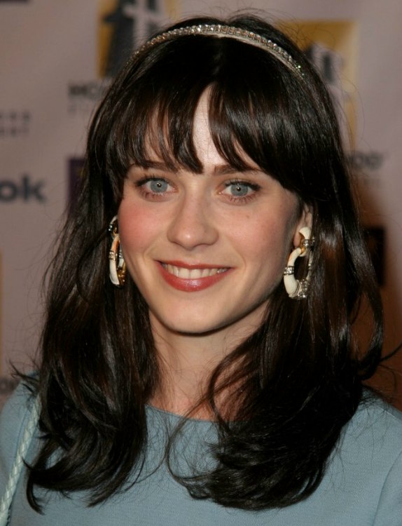 Zooey Deschanel with hair below the shoulders in an 