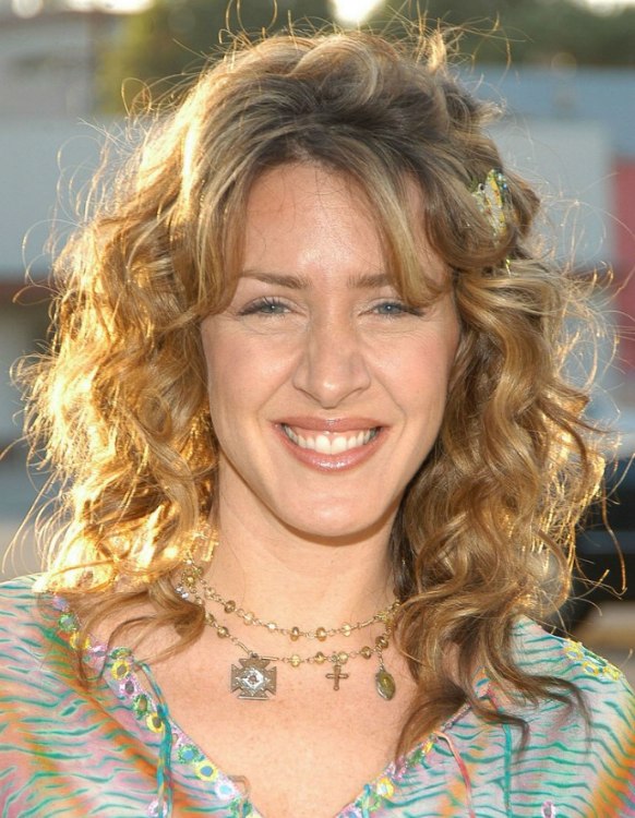 Joely Fisher wearing her multi colored blonde hair with spiral curls