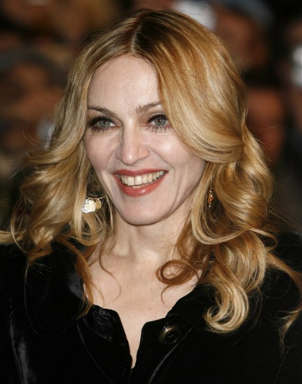 Madonna wearing her long blonde hair with foiled colors 