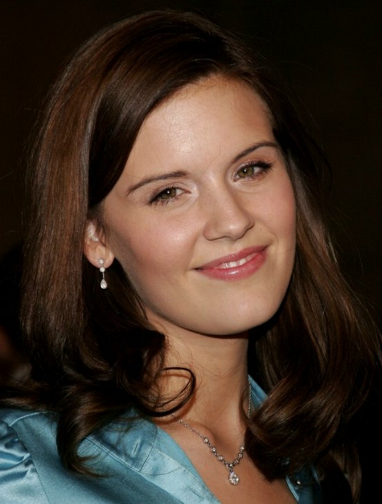 Maggie Grace sporting a long hairstyle and wearing a blue 