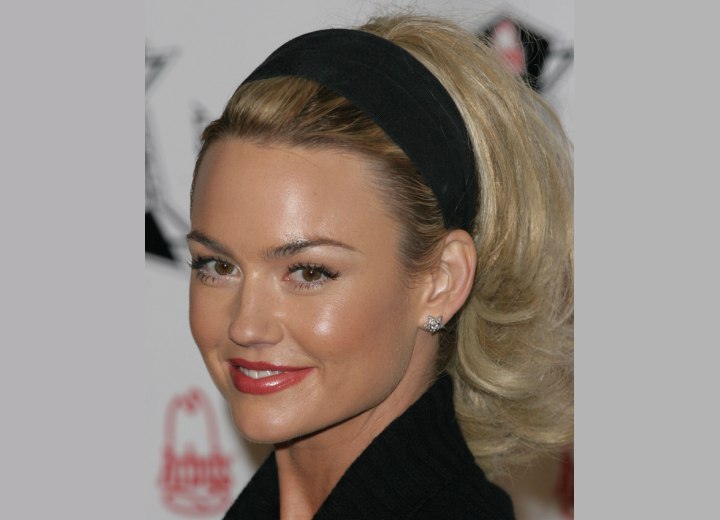 Kelly Carlson wearing a headband