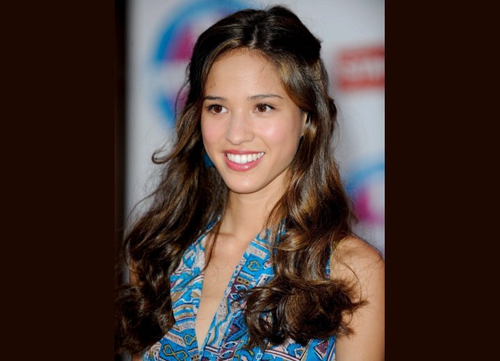 Kelsey Chow's long hair with curls and waves