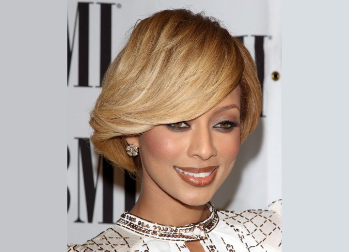 Keri Hilson's sleek hair with a dip over her eyebrow