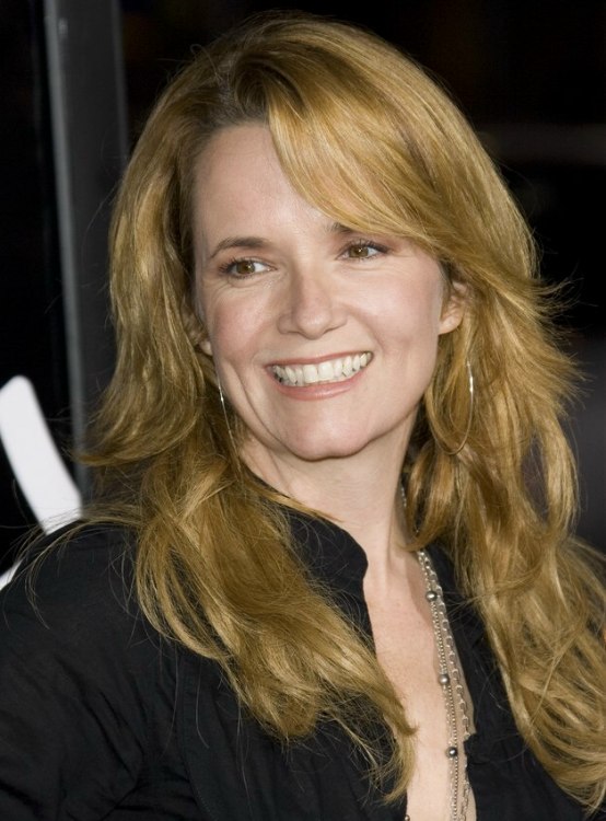 Lea Thompson with her hair in a long gypsy haircut with curls