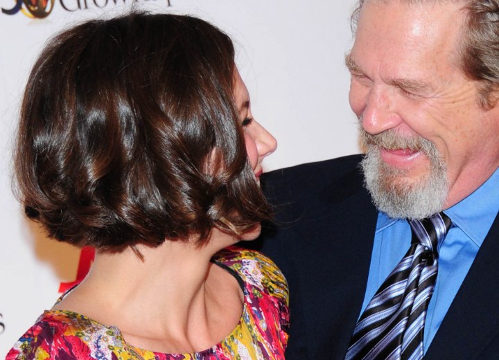 Side view of Maggie Gyllenhaal's short bob with curls and waves