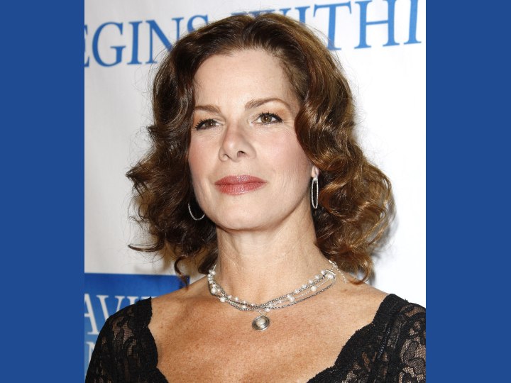 Marcia Gay Harden with mid length curly hair