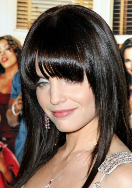 Mena Suvari's sleek and face framing long black hair with 