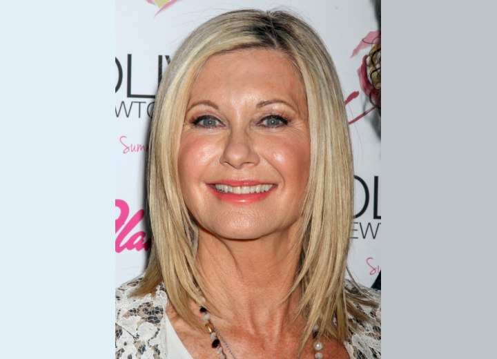 Olivia Newton John's smooth shoulder length hairstyle