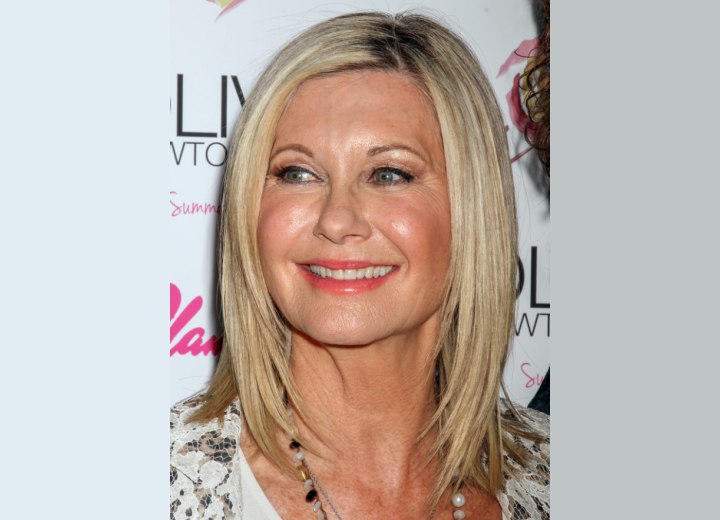 65 plus Olivia Newton John with a timeless hairstyle