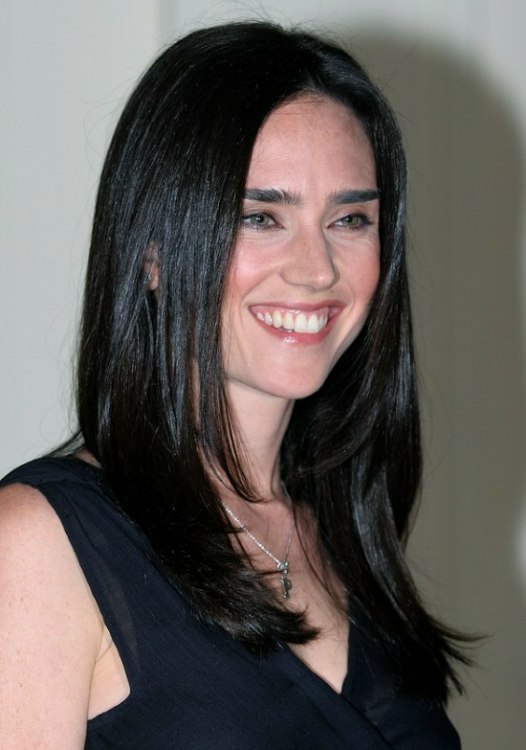 Jennifer Connelly with her long raven black hair styled to appear