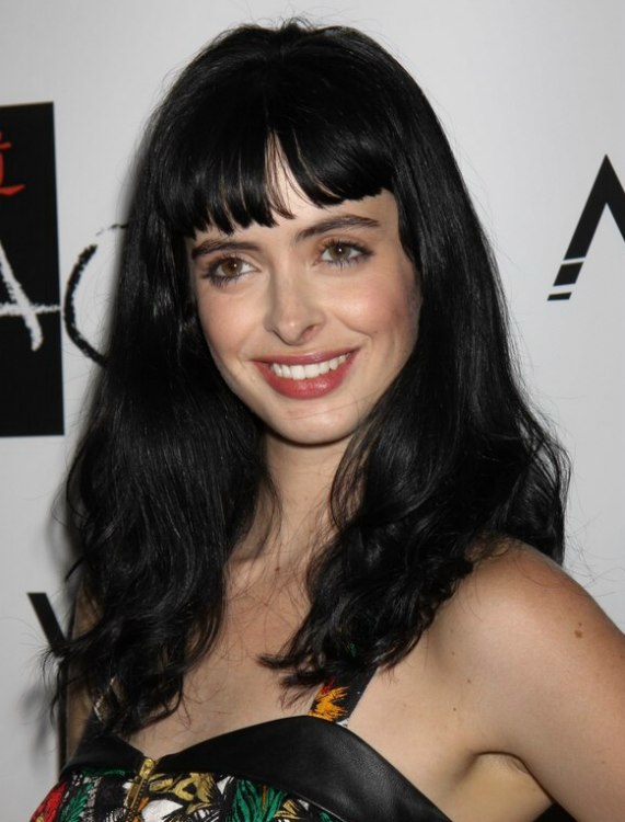 Krysten Ritter with long blue black hair and short bangs