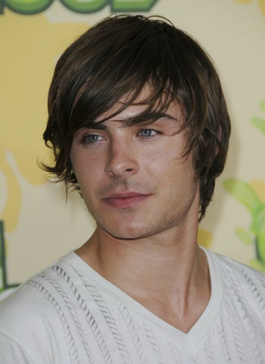 Zac Efron's roughed up shag haircut with ends flipping up