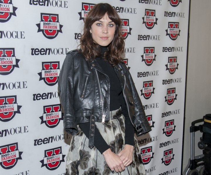 Alexa Chung wearing a skirt and dark turtleneck