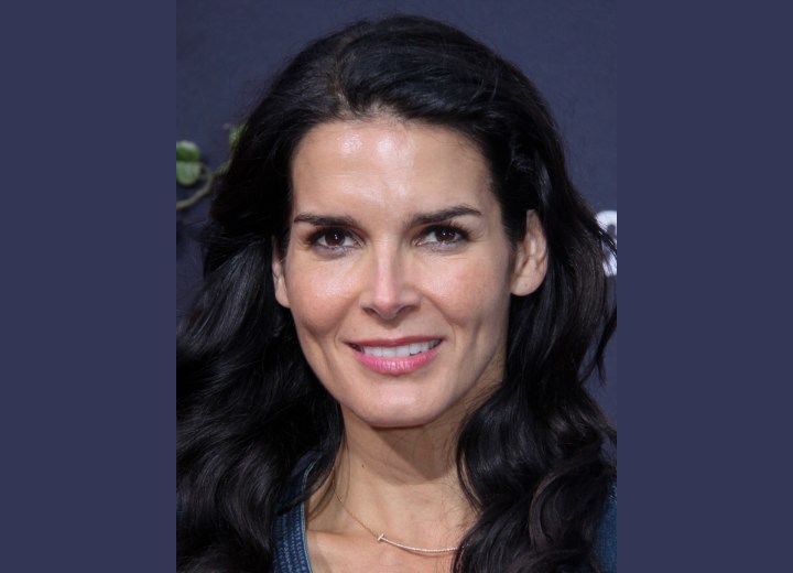 Angie Harmon with long wavy hair