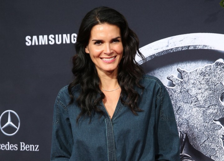 Angie Harmon wearing a denim jumpsuit