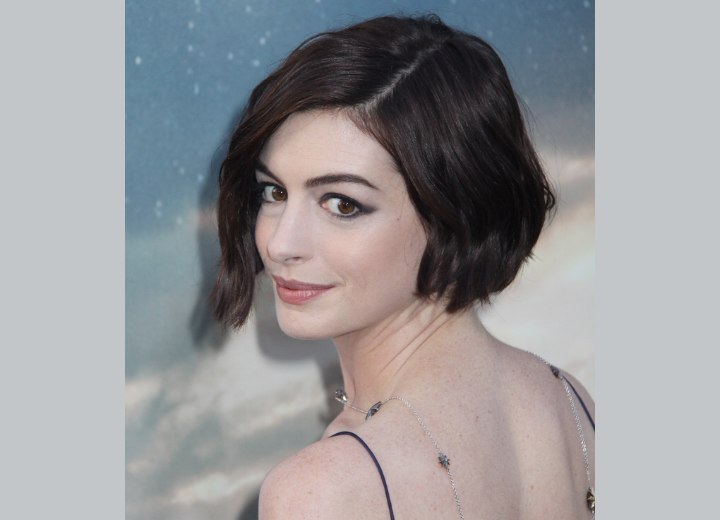 Anne Hathaway with her hair in a wavy short bob