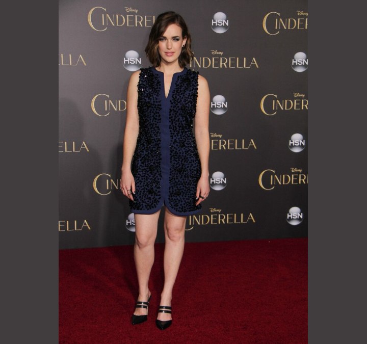 Elizabeth Henstridge wearing a blue dress with black sequins