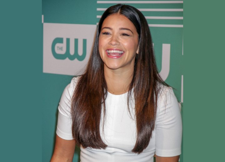 Gina Rodriguez with long and shiny straight hair