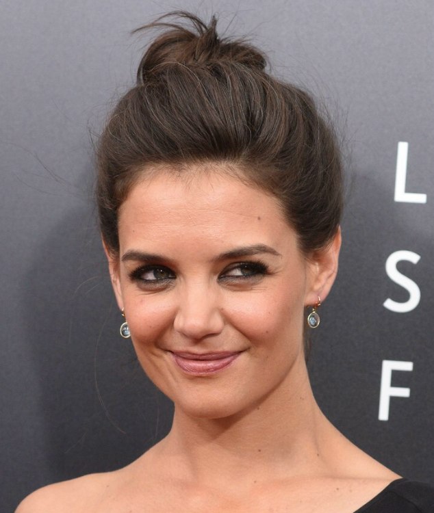 Katie Holmes with her hair styled into an informal bun