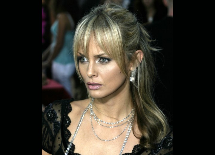 Izabella Scorupco wearing her hair up