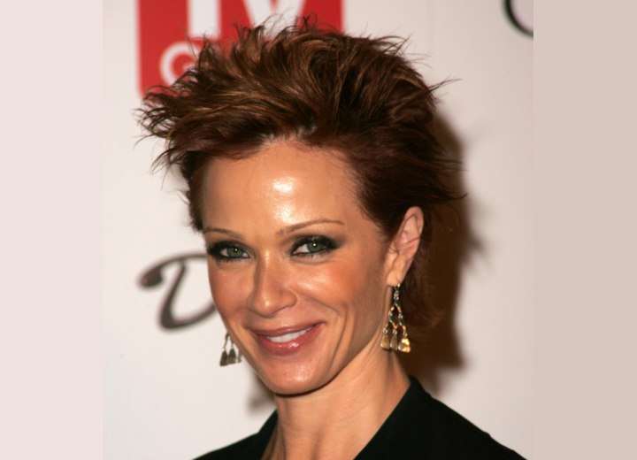 Lauren Holly wearing her hair short in a pixie that makes 