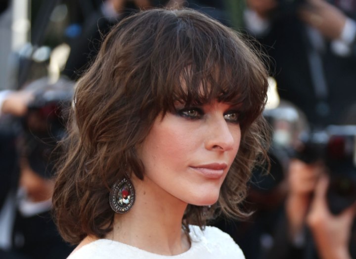 Milla Jovovich sporting mid-length hair with bangs