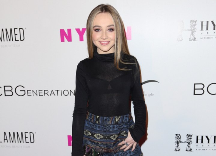 Sabrina Carpenter wearing a skirt and a black turtleneck