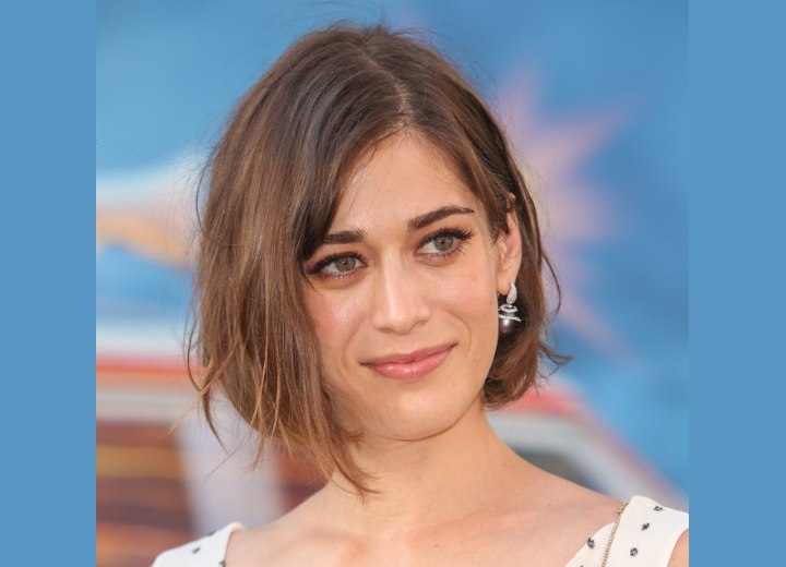 Lizzy Caplan - Bob with the hair tucked behind one ear