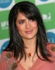 Selma Hayek wearing her hair in a long open style with side bangs