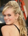 Sara Paxton with her hair styled up