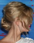 Sara Paxton sporting a 1920s updo with a low bun