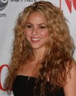 Shakira's very long hair with small waves and curls
