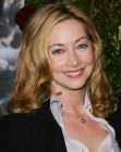 Sharon Lawrence sporting long hair with shimmer and highlights