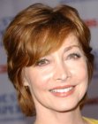 Sharon Lawrence rocking a short shag with long bangs