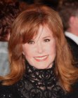Stefanie Powers aged over 70 and wearing her long layered hair with flipped out ends