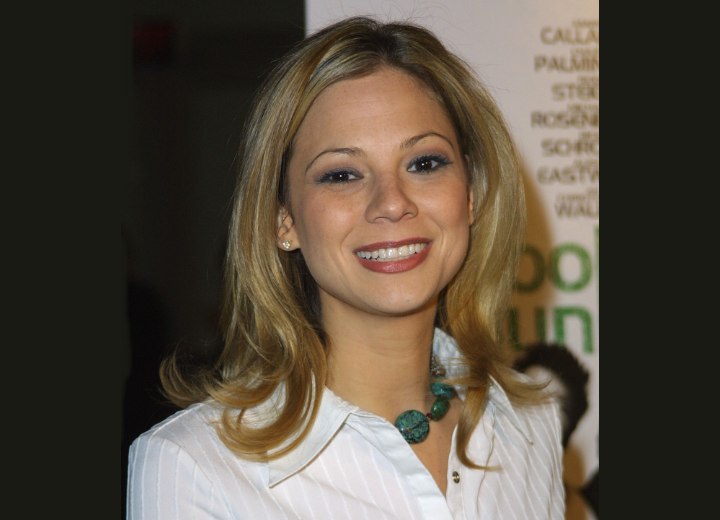 Tamara Braun with her hair flipping out