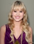 Taylor Spreitler's long hairstyle with ruffled curls