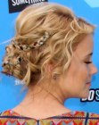 Taylor Spreitler sporting a braided medieval updo hairstyle