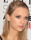 Taylor Swift wearing her mid-length hair side-parted and slicked back