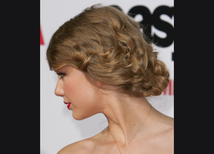 Taylor Swift  Hair braided and gathered into a large 