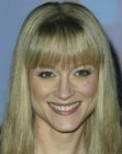 Teri Polo wearing long hair with textured below the eyebrows bangs