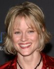 Teri Polo with her hair cut short and above the collar